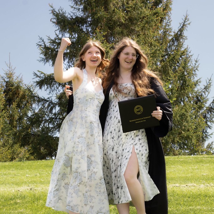 College graduate with friend