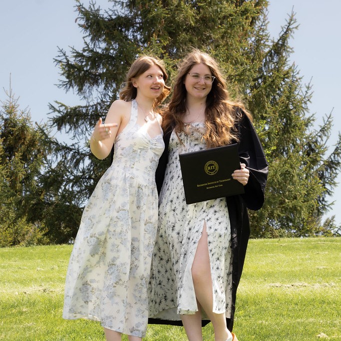 College graduate with friend