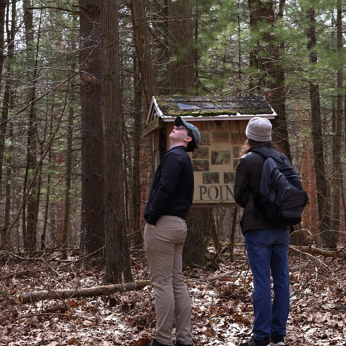 Two hikers at a trailhead